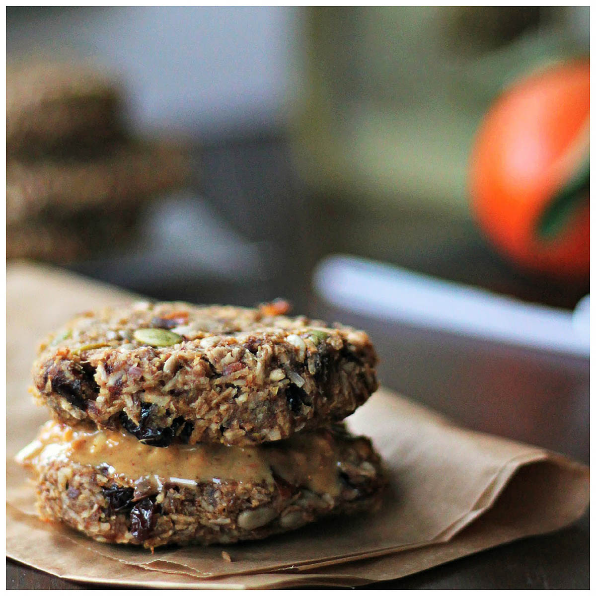 Two seedy cookies sandwiched with nut butter.