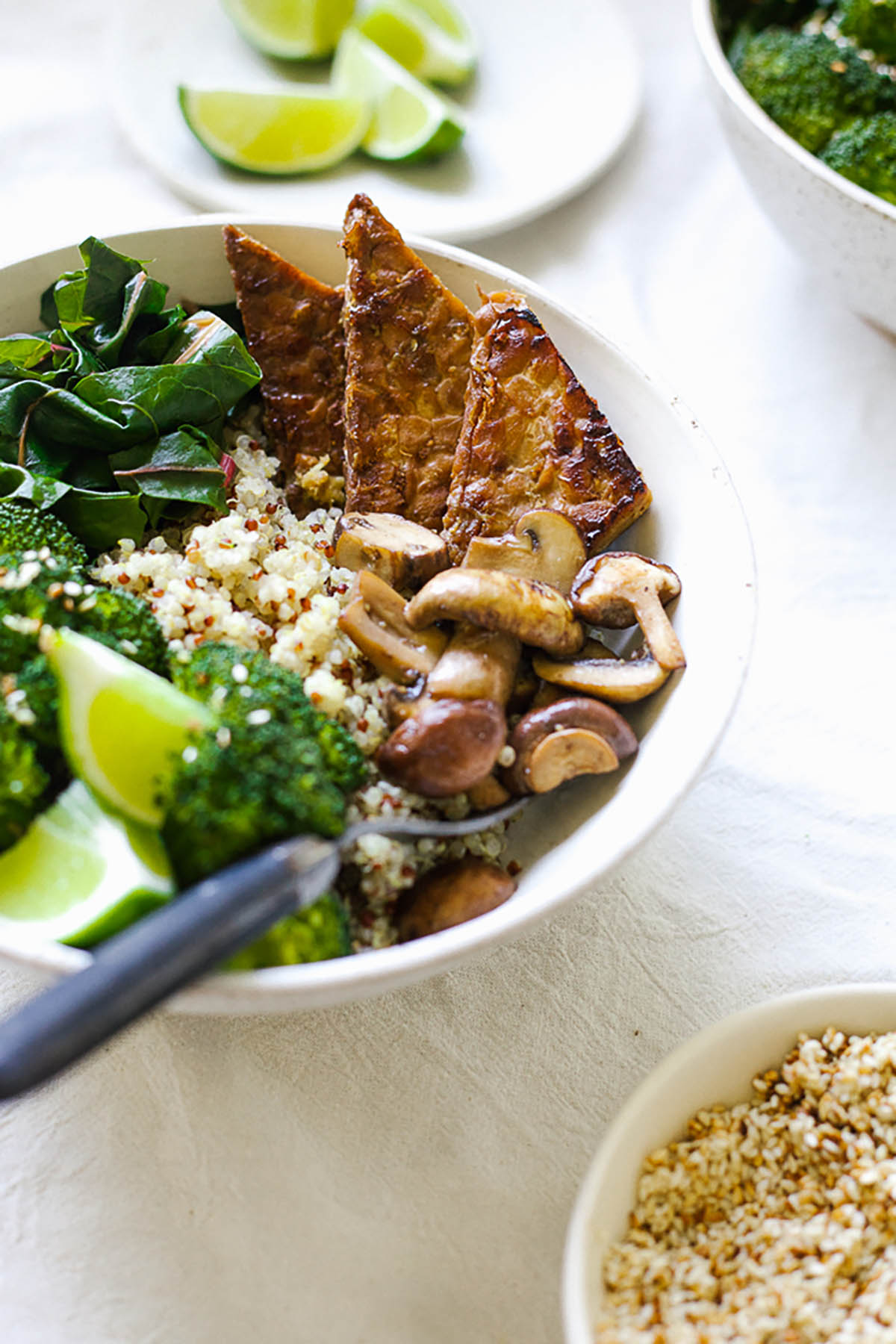 Quinoa bowl with tempeh and steamed vegetables.