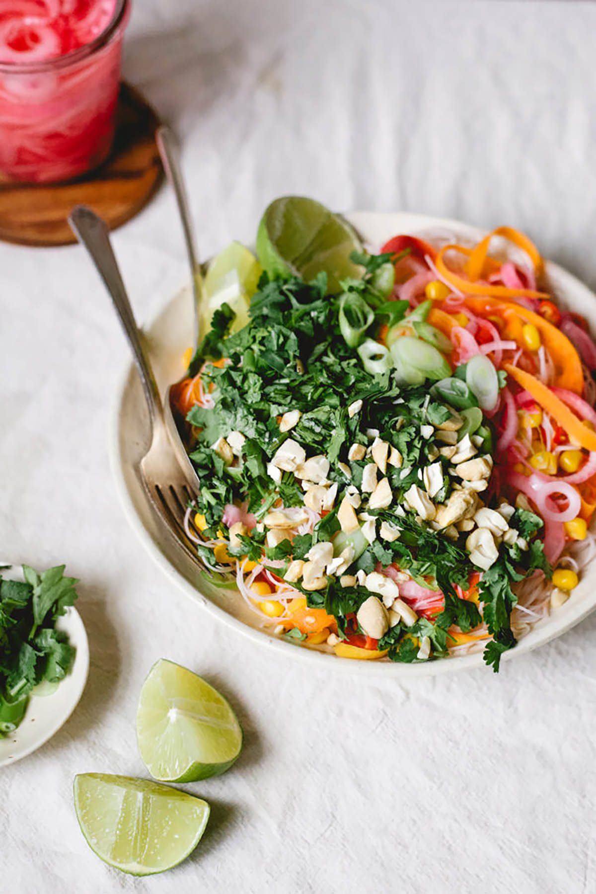 Asian-style salad with carrot ribbons, herbs, and peanuts.