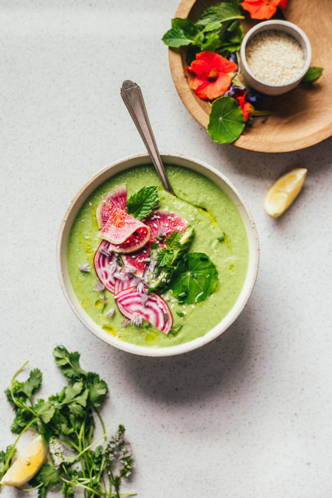 Vegan green gazpacho (cold soup) with cucumbers, avocado, and fresh herbs. #vegan #soup #coldsoup