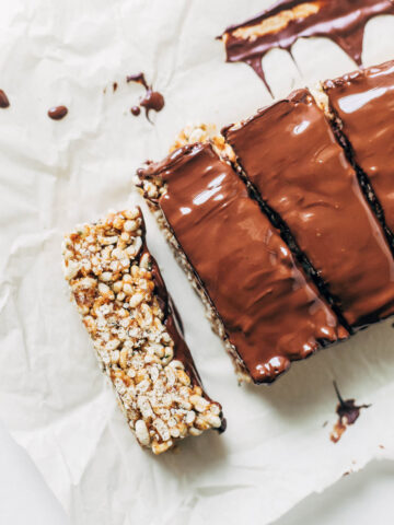 Rice crisp bars topped with melted chocolate.