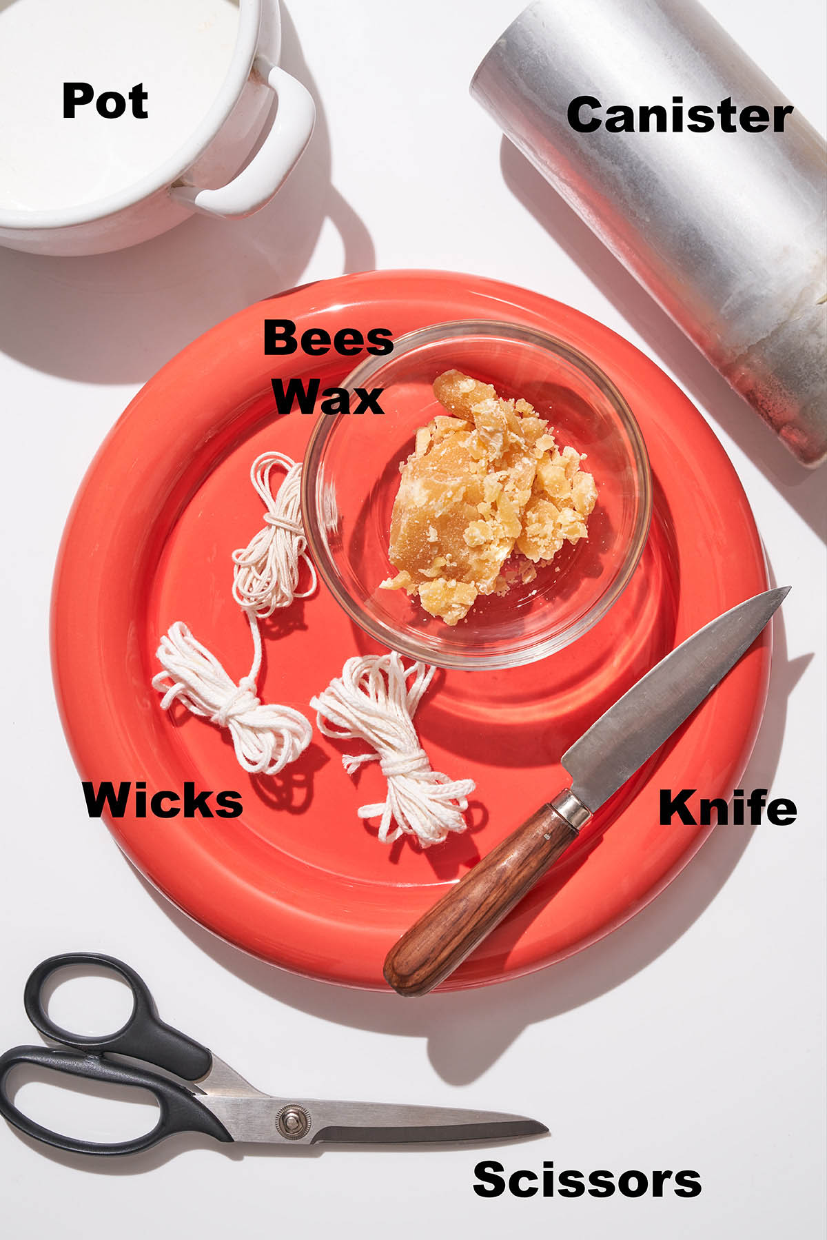 Beeswax hand dipped candle ingredients with labels.