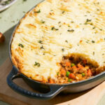 Cottage pie with a serving taken from the baking dish.