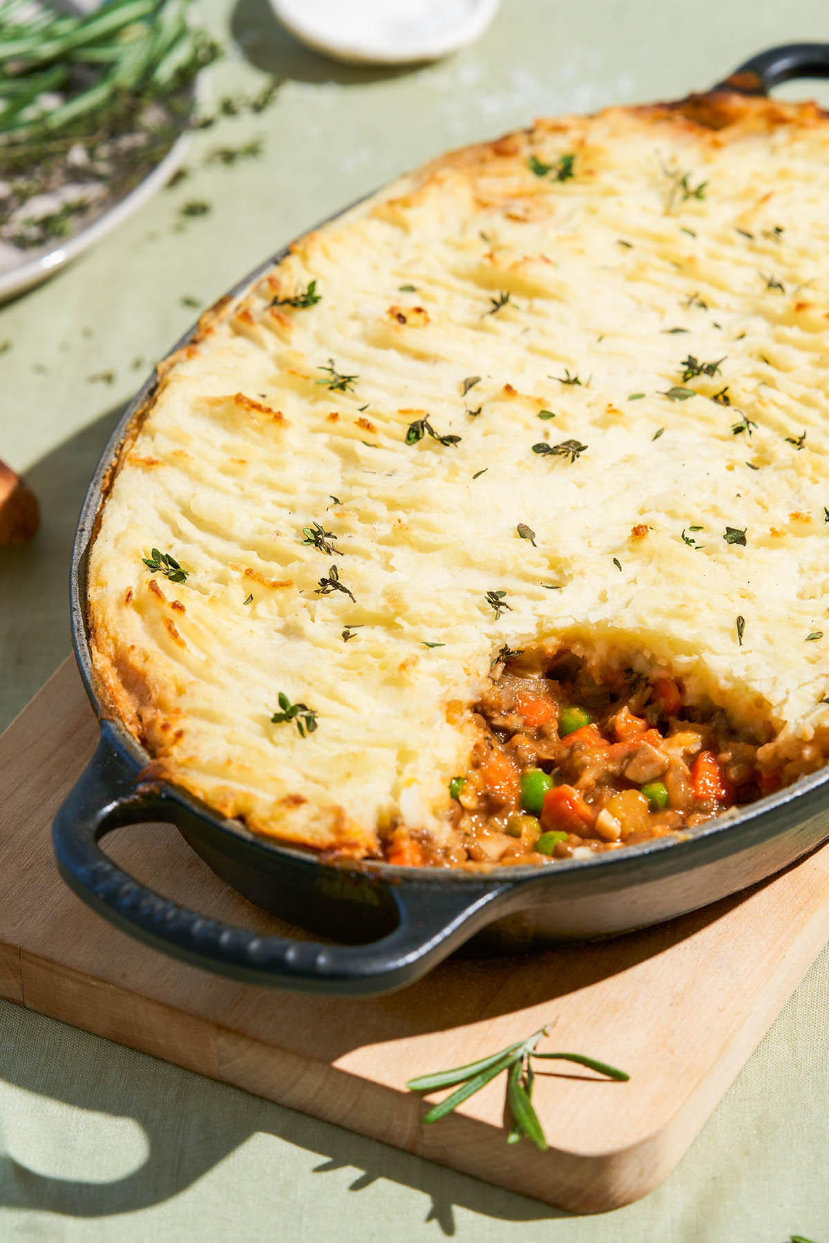 Cottage pie with a serving taken from the baking dish.