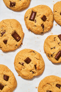 Top-down view of chocolate chip almond flour cookies in hard light.