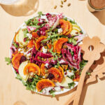 Squash salad on a serving plate, top down view.