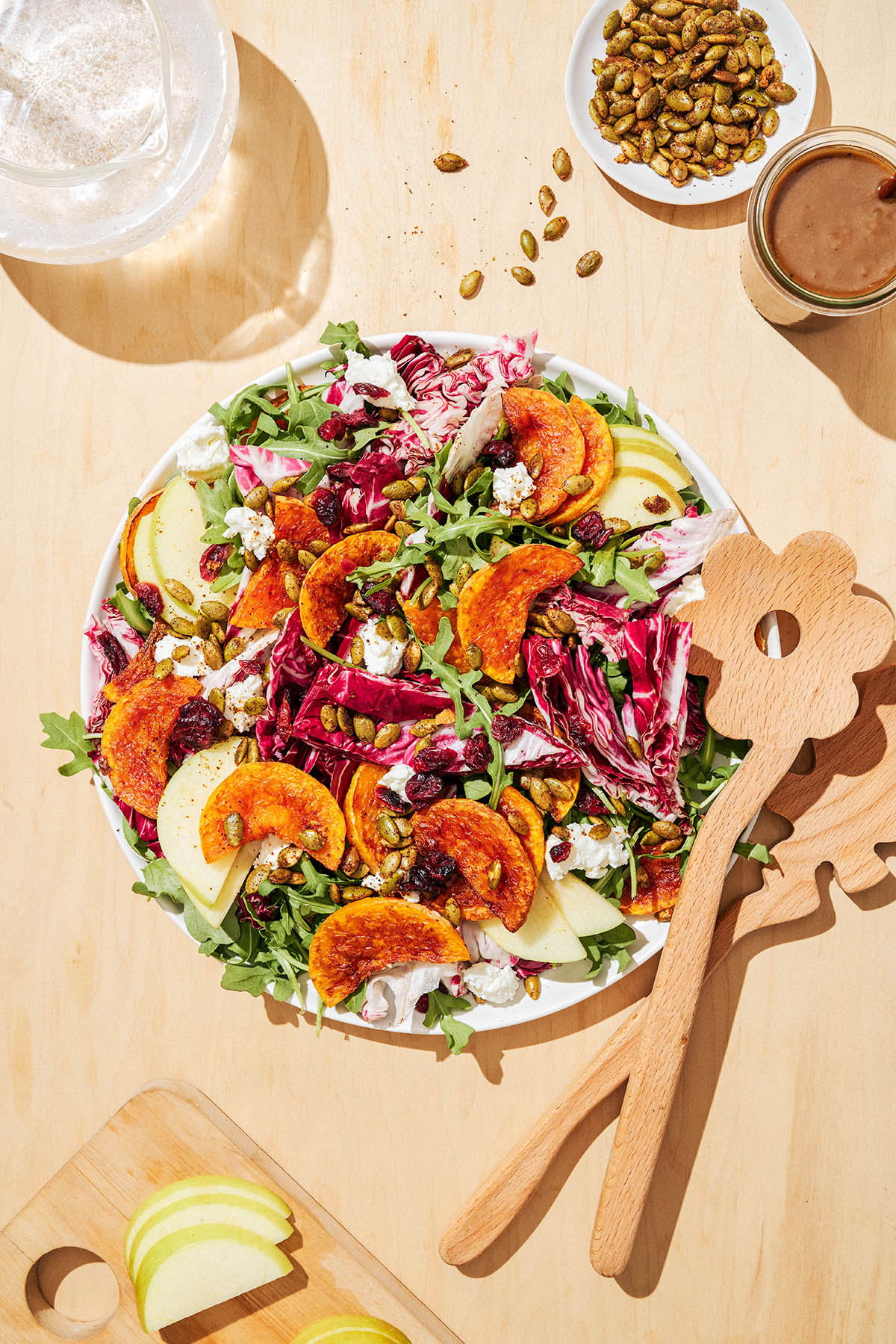 Squash salad on a serving plate, top down view.